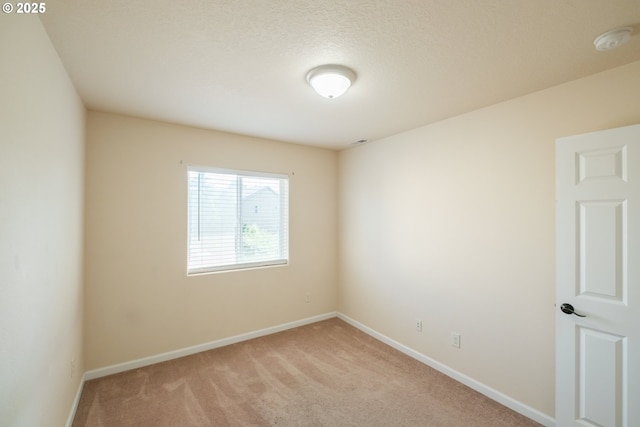 14146 Brittany Ter, Oregon City, OR 97045 - unfurnished room featuring a smoke detector, light carpet, and baseboards