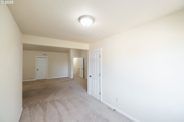 14146 Brittany Ter, Oregon City, OR 97045 - unfurnished room with baseboards, light carpet, and a textured ceiling