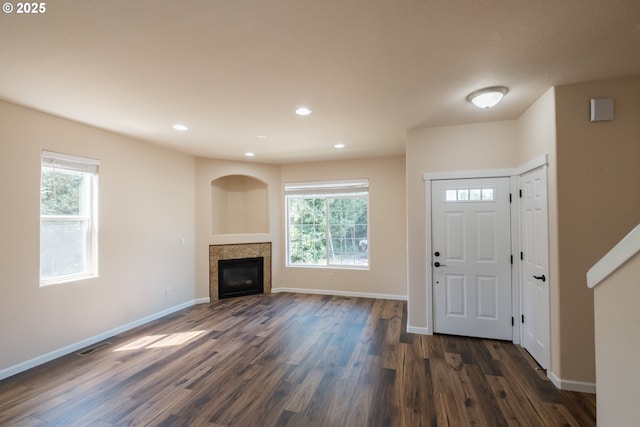 14146 Brittany Ter, Oregon City, OR 97045 - entryway with dark wood finished floors, baseboards, a fireplace, and recessed lighting