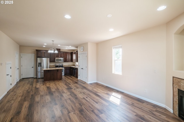 14146 Brittany Ter, Oregon City, OR 97045 - kitchen featuring stainless steel appliances, recessed lighting, dark brown cabinets, dark wood-style flooring, and baseboards