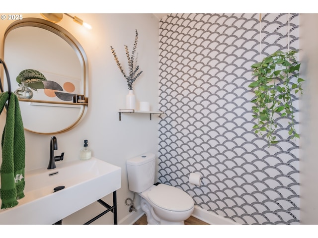 bathroom featuring a sink and toilet