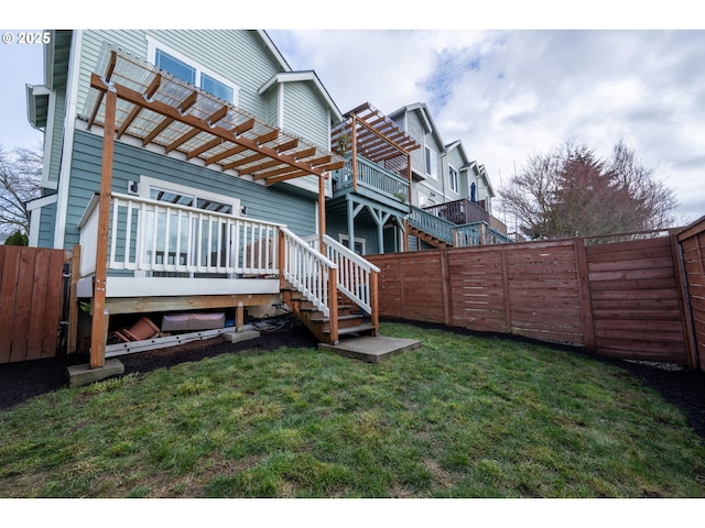 exterior space featuring a deck, a fenced backyard, stairway, a lawn, and a pergola