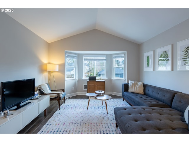 living room with lofted ceiling, baseboards, and dark wood finished floors