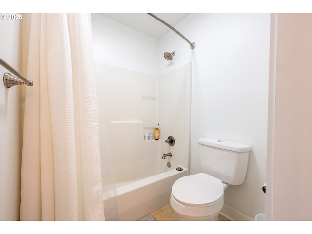 full bathroom featuring shower / bath combo and toilet