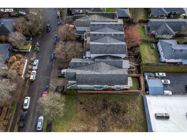 birds eye view of property with a residential view