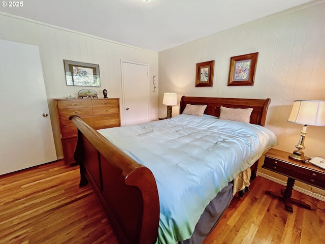 bedroom with wood finished floors
