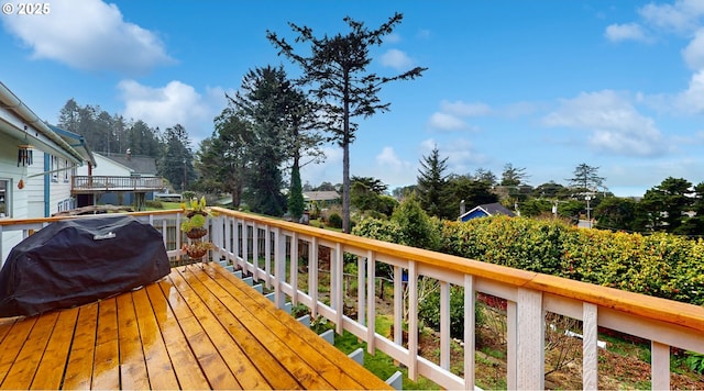wooden terrace with grilling area