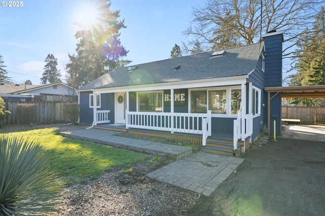 10095 SW 82nd Ave, Portland, OR 97223 - view of front of home with a shingled roof, a chimney, a porch, and a carport