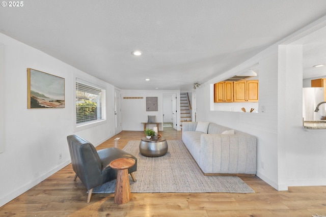 10095 SW 82nd Ave, Portland, OR 97223 - living area featuring stairs, recessed lighting, light wood finished floors, and baseboards