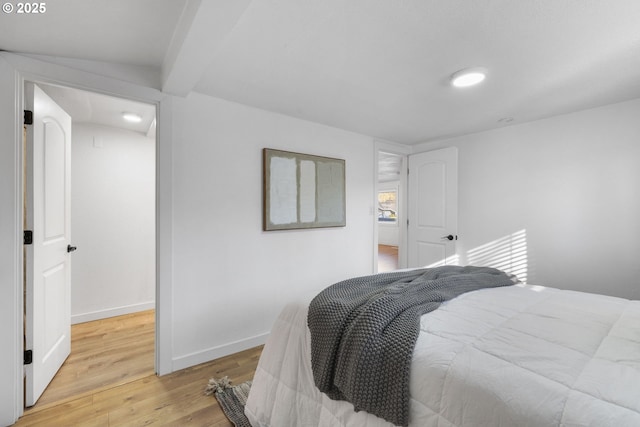 10095 SW 82nd Ave, Portland, OR 97223 - bedroom with light wood-type flooring, baseboards, and beamed ceiling