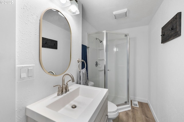 10095 SW 82nd Ave, Portland, OR 97223 - full bath with toilet, a stall shower, wood finished floors, vanity, and baseboards
