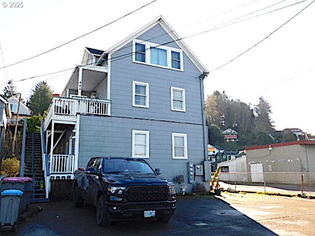 rear view of house with a balcony