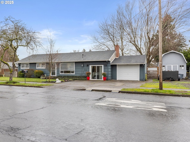 single story home with driveway, fence, a front yard, a garage, and a chimney