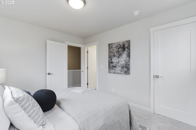 bedroom with carpet flooring and baseboards