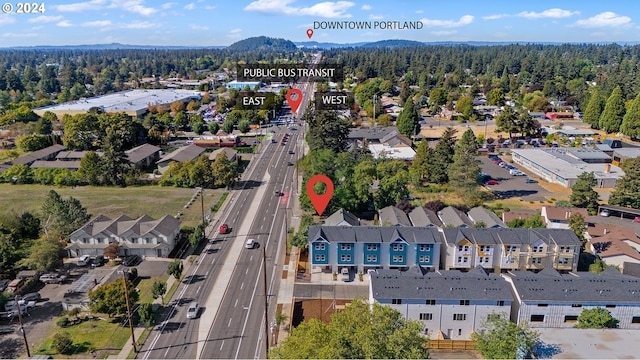 drone / aerial view with a forest view and a residential view