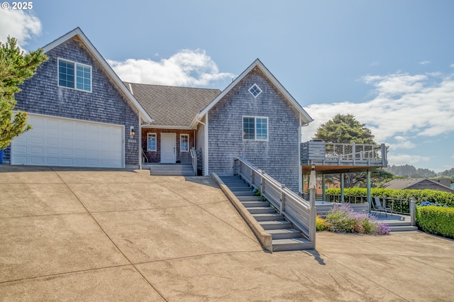 5020 NW Lee Ave, Lincoln City, OR 97367 - view of front of property with concrete driveway, covered porch, and roof with shingles