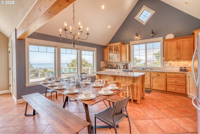 5020 NW Lee Ave, Lincoln City, OR 97367 - dining area featuring light tile patterned flooring, a chandelier, high vaulted ceiling, and recessed lighting