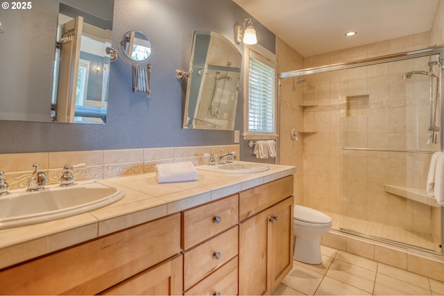 5020 NW Lee Ave, Lincoln City, OR 97367 - bathroom with a stall shower, double vanity, tile patterned flooring, and a textured wall