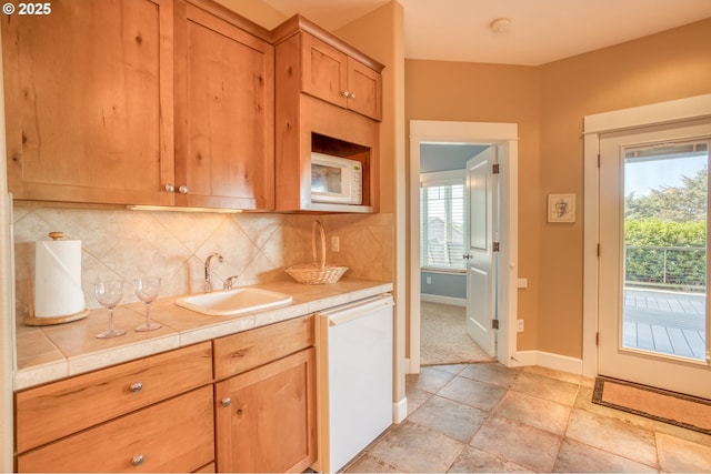 5020 NW Lee Ave, Lincoln City, OR 97367 - kitchen with white appliances, decorative backsplash, and tile countertops