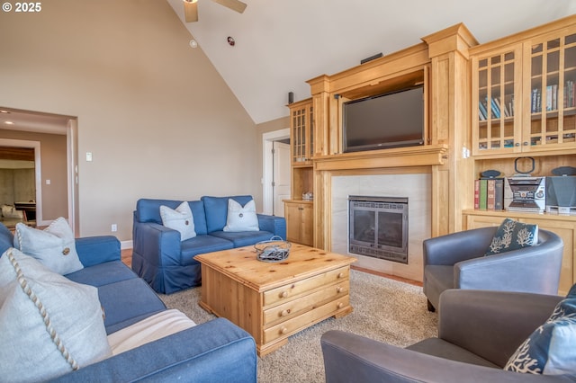 5020 NW Lee Ave, Lincoln City, OR 97367 - carpeted living room featuring high vaulted ceiling, ceiling fan, and a tile fireplace
