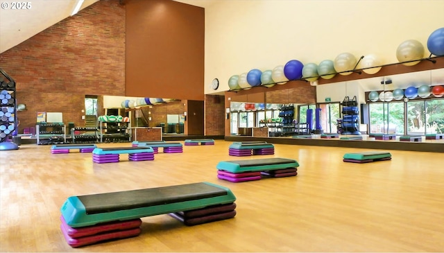 86 Kingsgate Rd Unit D204, Lake Oswego, OR 97035 - workout area featuring high vaulted ceiling and wood finished floors