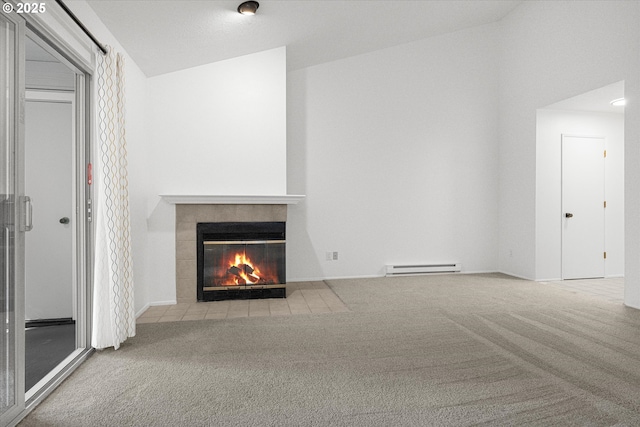 86 Kingsgate Rd Unit D204, Lake Oswego, OR 97035 - unfurnished living room featuring baseboard heating, carpet floors, and a tiled fireplace