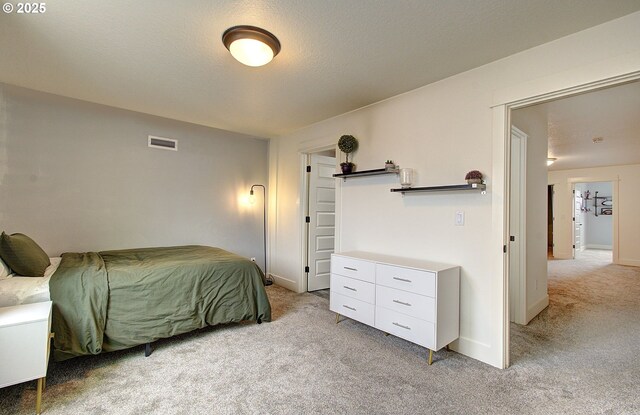 bedroom featuring baseboards, a textured ceiling, lofted ceiling, and carpet