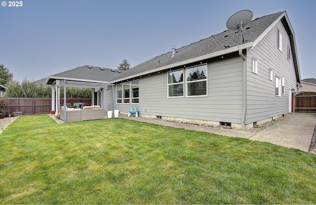 back of house featuring a lawn, an outdoor hangout area, a patio, and fence