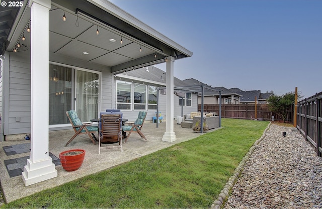 view of yard featuring an outdoor living space, a residential view, a patio, and a fenced backyard