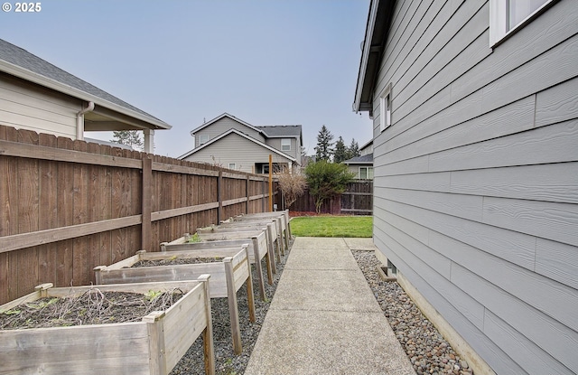 exterior space with a garden and fence