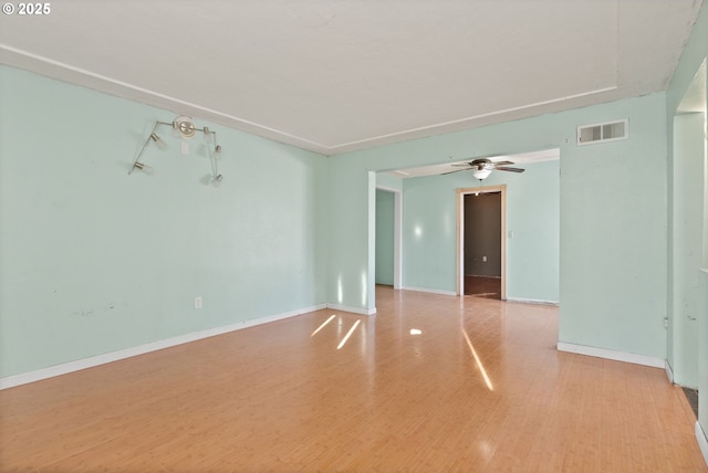 unfurnished room featuring ceiling fan and light wood-type flooring