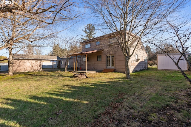 back of property with a storage shed and a yard