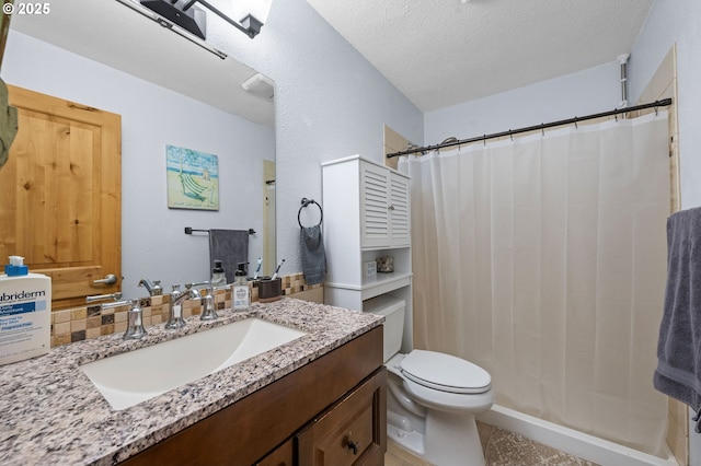 full bathroom with toilet, vanity, a textured ceiling, and a shower with shower curtain