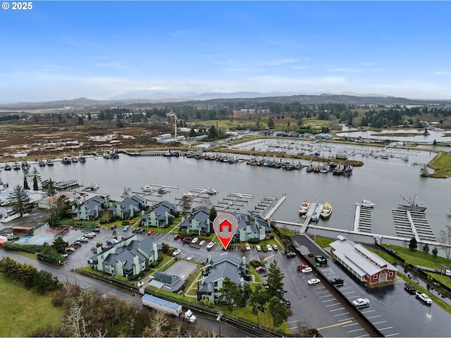 birds eye view of property with a water view