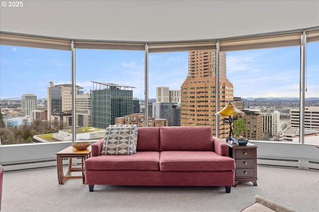 sunroom / solarium featuring a baseboard heating unit and a city view