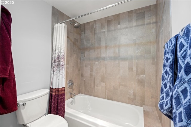 bathroom with shower / tub combo and toilet