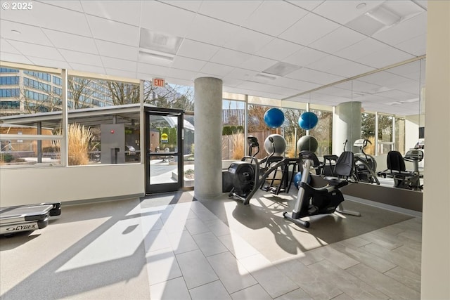 gym with a wall of windows