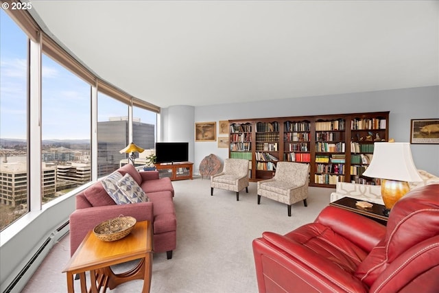 living area with a baseboard heating unit and carpet