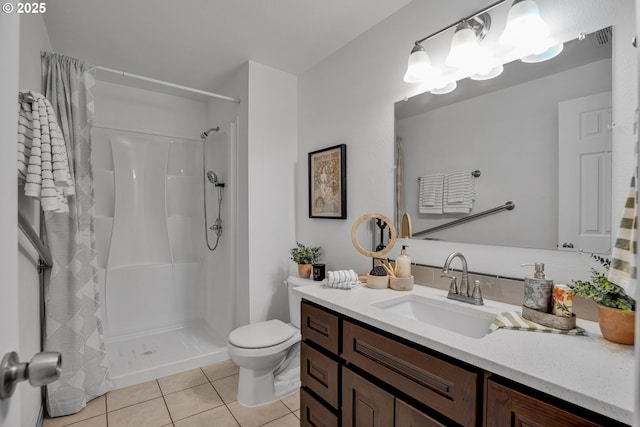 bathroom featuring vanity, a shower with curtain, toilet, and tile patterned flooring