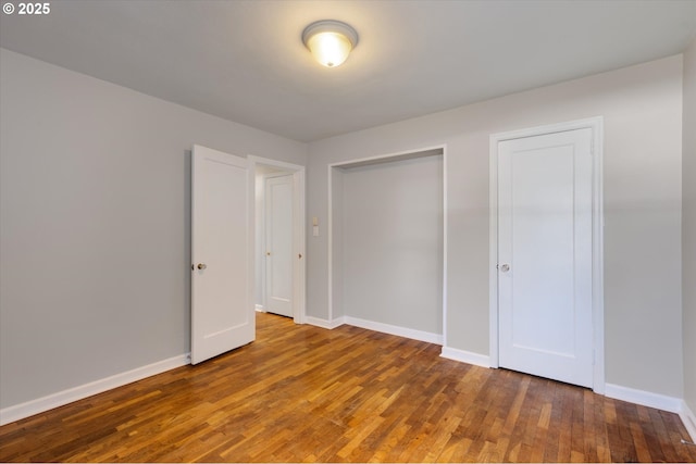 unfurnished bedroom with hardwood / wood-style floors