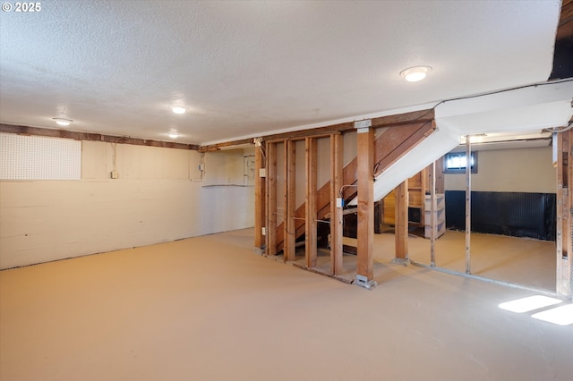 basement with a textured ceiling