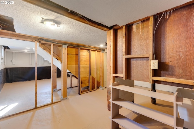 basement with a textured ceiling