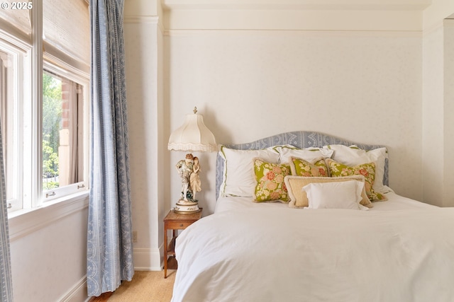 carpeted bedroom with baseboards