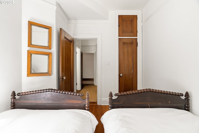 bedroom featuring wood finished floors