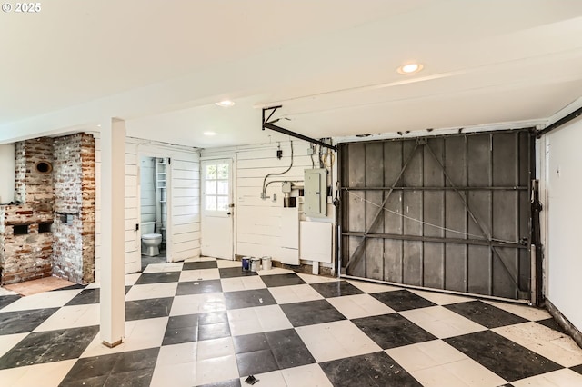 garage featuring recessed lighting and electric panel
