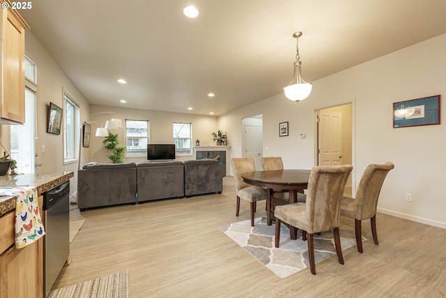 dining space with light wood-type flooring