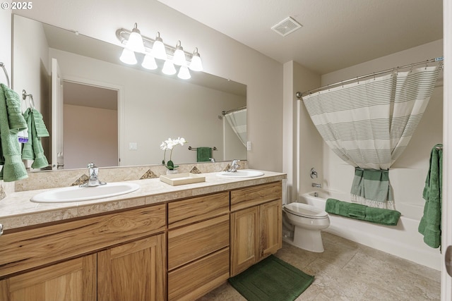 full bathroom with vanity, toilet, and shower / tub combo