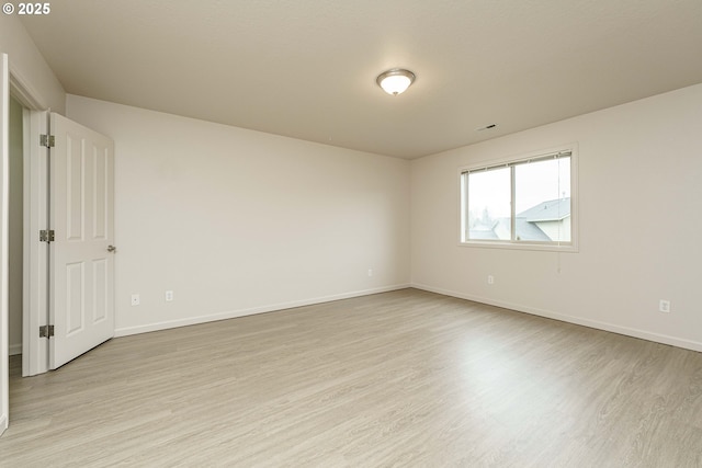 empty room with light wood-type flooring