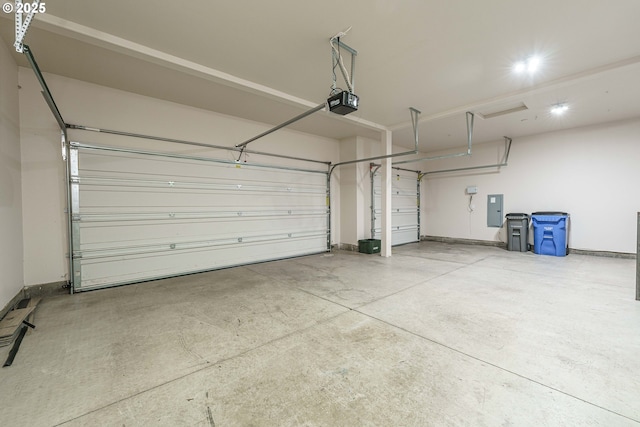 garage featuring a garage door opener and electric panel