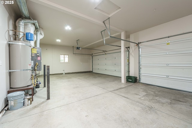 garage with a garage door opener and water heater